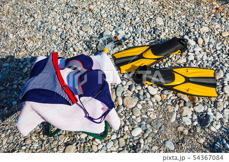 Bikini, sport fins and towel. Bikini, sport fins and towel. 54367084