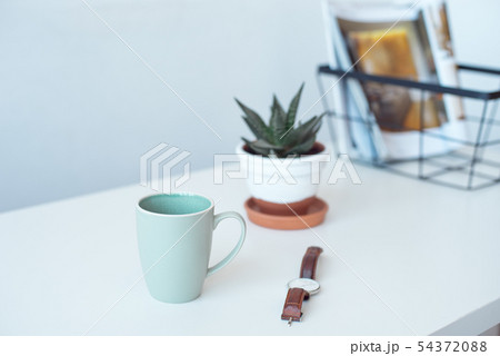 White desk table with copy space, supplies and coffee mug. Front view workspace and copy space. White desk table with copy space, supplies and coffee mug. Front view workspace and copy space. 54372088