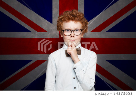 Thinking child boy student against the UK flag Thinking child boy student against the UK flag 54373653