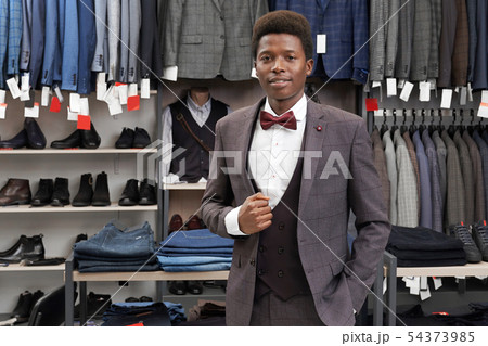 Male client of shop wearing in grey suit, looking at camera. Male client of shop wearing in grey suit, looking at camera. 54373985