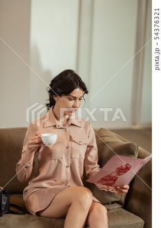 Businesswoman reading magazine in cosmetics surgery clinic Businesswoman reading magazine in cosmetics surgery clinic 54376321