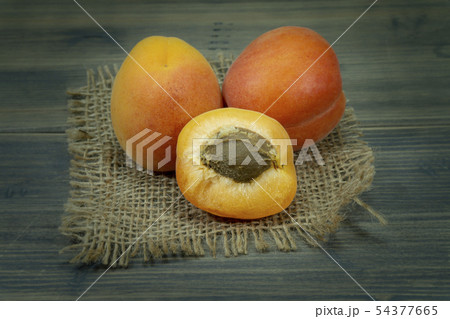 Fresh whole and sliced halved apricots 54377665