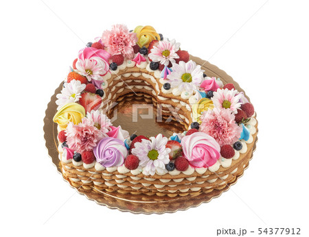 Heart shaped puff cake with fruit and flowers. Heart shaped puff cake with fruit and flowers. 54377912
