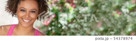 African American Woman Exercising Outdoors African American Woman Exercising Outdoors 54378974