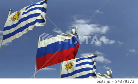 Flags of Uruguay and Russia against blue sky, 3D rendering 54379272