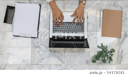 Top view of business woman working with laptop Top view of business woman working with laptop 54379281