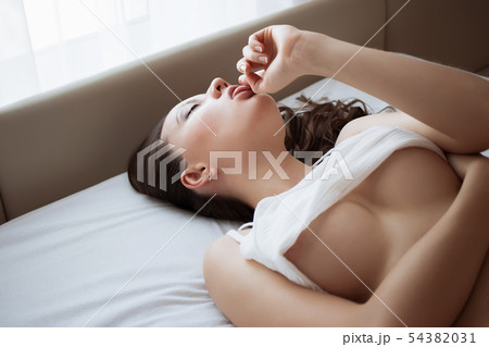 Attractive sensual woman in lingerie on bed in 54382031