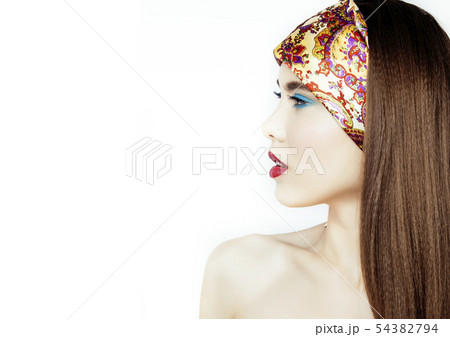 young pretty modern girl with bright shawl on head emotional posing isolated on white background young pretty modern girl with bright shawl on head emotional posing isolated on white background 54382794