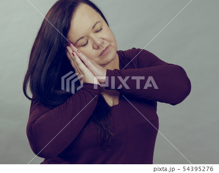 Woman being sleepy gesturing 54395276