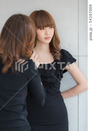 Young lady in black dress 54397009