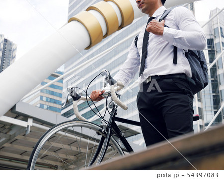 Business man worker riding bicycles on street. Business man worker riding bicycles on street. 54397083