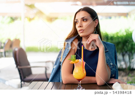 A beautiful young girl of European appearance is A beautiful young girl of European appearance is 54398418