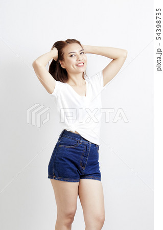 woman thai in t-shirt and jeans wall background 54398735