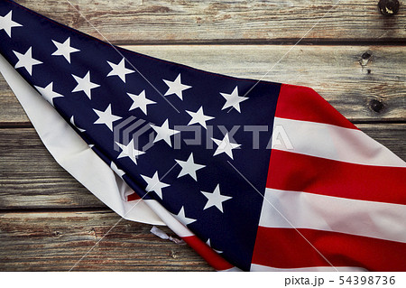 American flag on old rustic wooden board American flag on old rustic wooden board 54398736