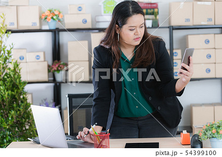 plump lady in startup office 54399100