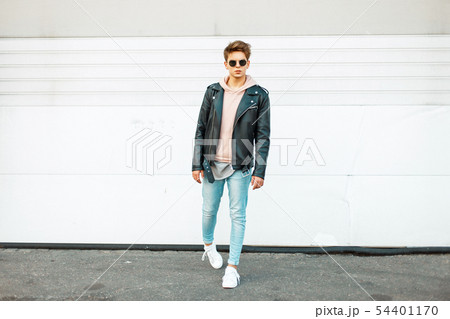 Stylish handsome young man with sunglasses Stylish handsome young man with sunglasses 54401170