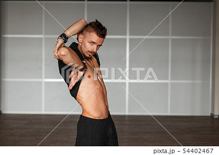 Handsome man in a black clothes with a naked torso 54402467