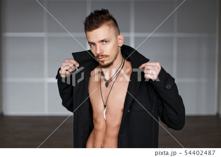Handsome fashionable man with a naked torso Handsome fashionable man with a naked torso 54402487