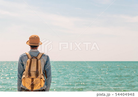 A man with backpack and looking sea. concept for A man with backpack and looking sea. concept for 54404948