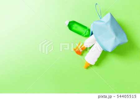 Top view of female cosmetics bag full of suncream Top view of female cosmetics bag full of suncream 54405515