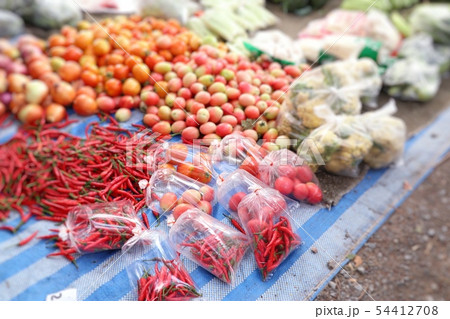 Shops selling vegetables at the market Shops selling vegetables at the market 54412708