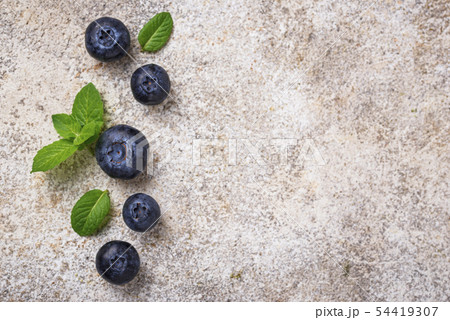 Fresh blueberries on light background Fresh blueberries on light background 54419307