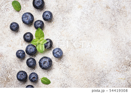 Fresh blueberries on light background Fresh blueberries on light background 54419308