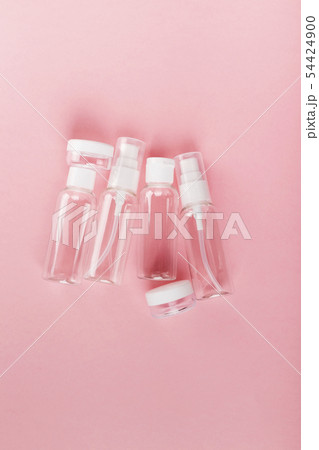Travel small bottle set on a pink background. Top 54424900