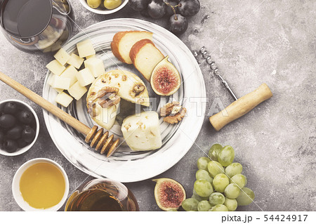 Snacks with wine - various types of cheeses, figs, Snacks with wine - various types of cheeses, figs, 54424917