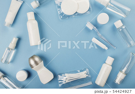 Travel small bottle set on blue background. Top 54424927