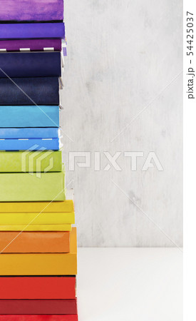 Stack of colorful rainbow books on white Stack of colorful rainbow books on white 54425037