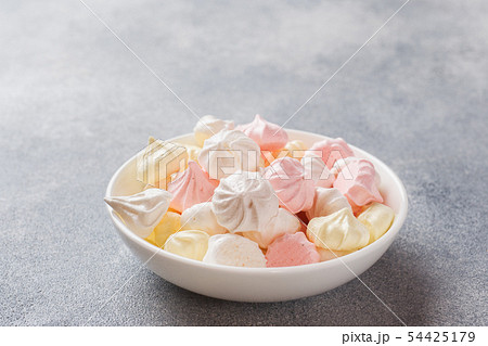 Small homemade meringue on plate. Homemade  54425179