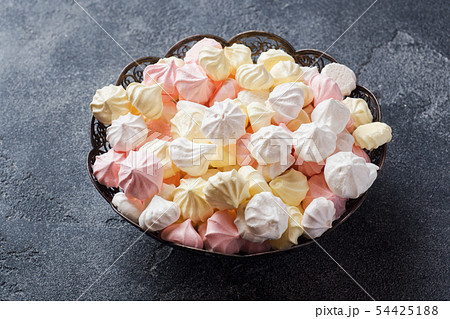 Small homemade meringue on plate. Homemade Small homemade meringue on plate. Homemade 54425188