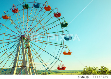 Scenic view of ferris wheel in amusement park Scenic view of ferris wheel in amusement park 54432589