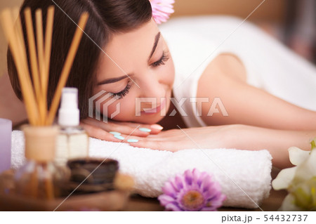 Masseur doing massage on the back of woman in the spa salon. 54432737