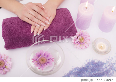 Nail Salon. Closeup Of Beautician Hands Cleaning Female Client's Nails With Orange Wooden Stick 54433697