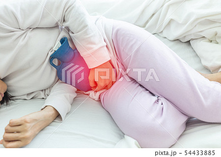 woman have bladder and uti pain sitting on bed woman have bladder and uti pain sitting on bed 54433885