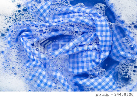 Blue white tablecloth soak in powder detergent Blue white tablecloth soak in powder detergent 54439306