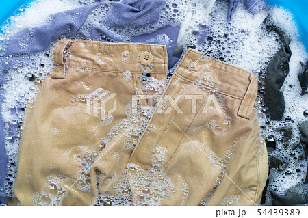 Trousers soak in powder detergent water Trousers soak in powder detergent water 54439389