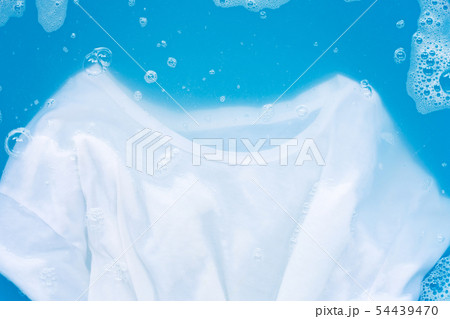 White T - shirt soak in powder detergent water 54439470
