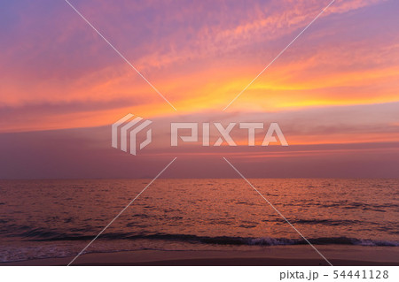 Sunset on a beach with colorful sky in twilight 54441128