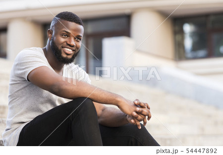 Portrait of african guy student waiting for lessons Portrait of african guy student waiting for lessons 54447892