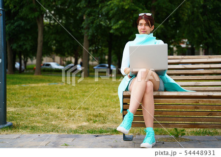 Portrait of business woman sitting with laptop 54448931