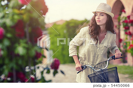 Woman in Tuscany garden. Summer time Woman in Tuscany garden. Summer time 54450066