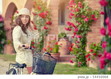 Woman in Tuscany garden. Summer time Woman in Tuscany garden. Summer time 54450068