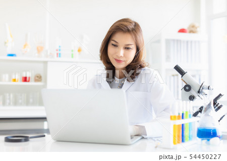 Scientist use notebook record experiment results.. Scientist use notebook record experiment results.. 54450227