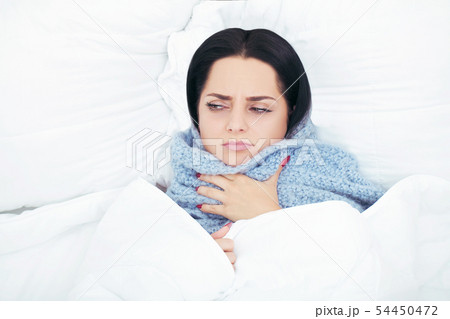 Beautiful woman lying and sleep on the snowy bed 54450472