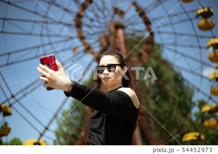 Girl taking selfie Girl taking selfie 54452973