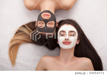 Spa. Group woman getting facial mask and gossip Spa. Group woman getting facial mask and gossip 54454771