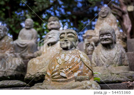 Stone figures of Japanese Buddhist monks close-up. 54455360